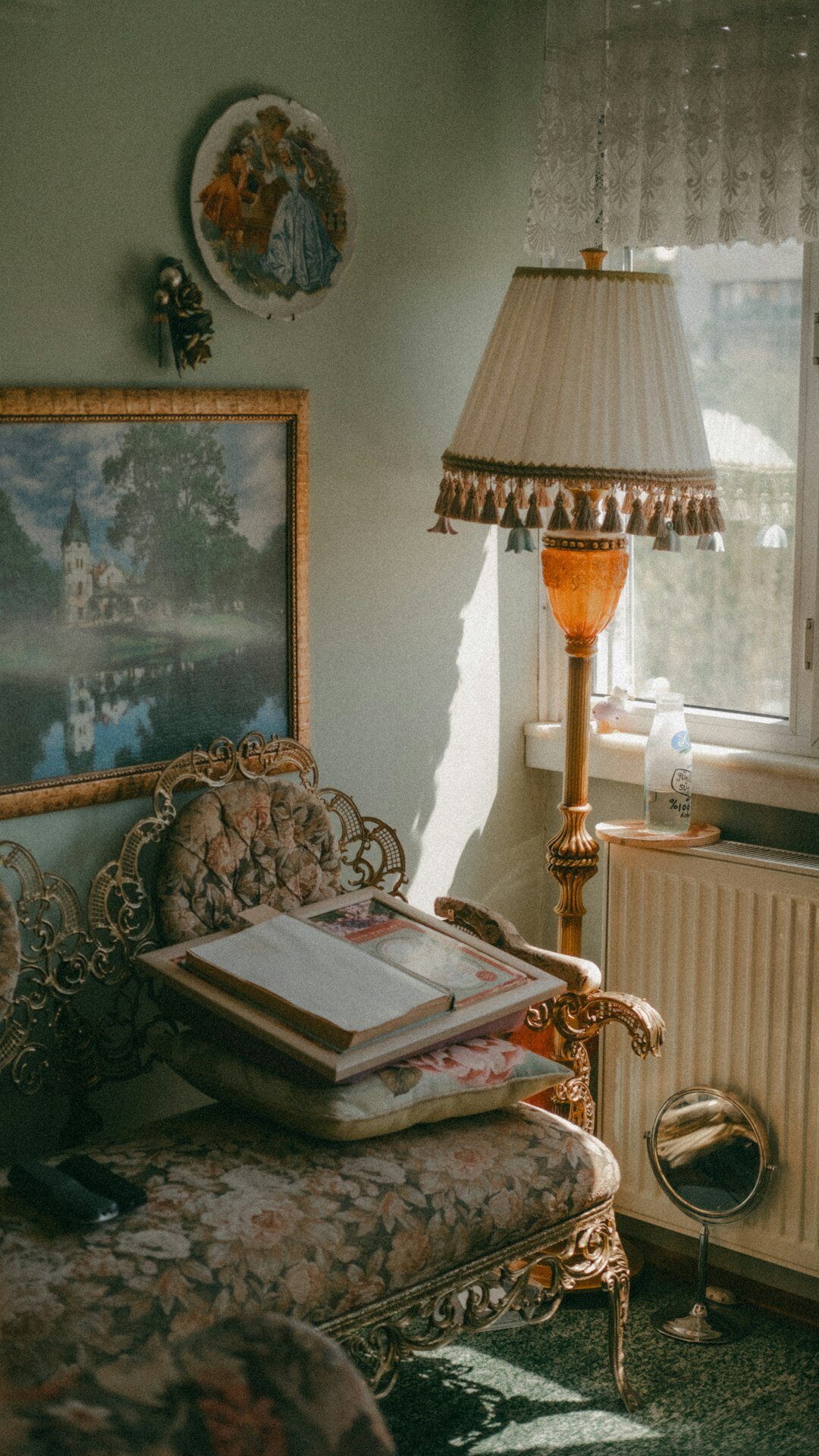 person reading book by lamp